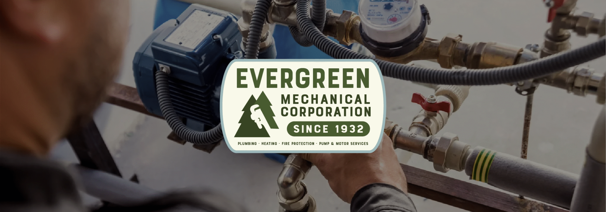 Evergreen Mechanical logo over an image of an HVAC professional working.